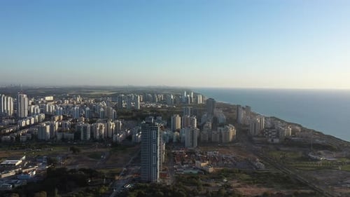 Aerial view of the city of Netanya and its coastline - part of the Israeli coastal plain, at sunset