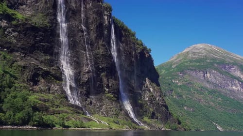 The Sven sisters waterfall - an iconic feature of the Geiranger fjord, Norway. Seven steams falling