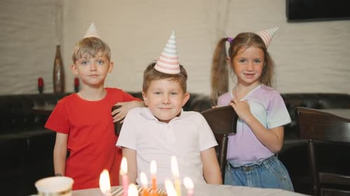 Happy Children Celebrate Birthday With Cake and Friends