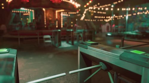 Abandoned Amusement Park with Empty Turnstiles and Dimly Lit Atmosphere at Dusk