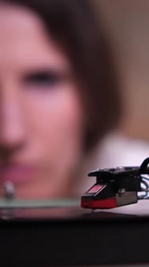 Close Up of Record Player with Woman