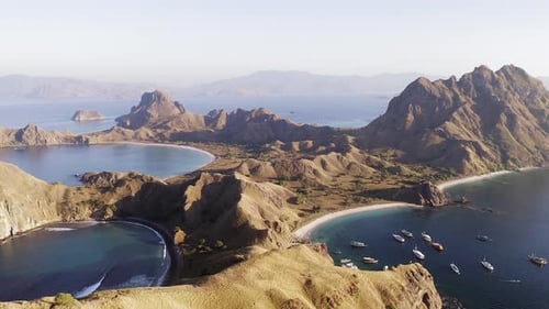 Aerial footage of Padar Island, Indonesia, known for its rugged hills and beautiful virgin sandy Bea