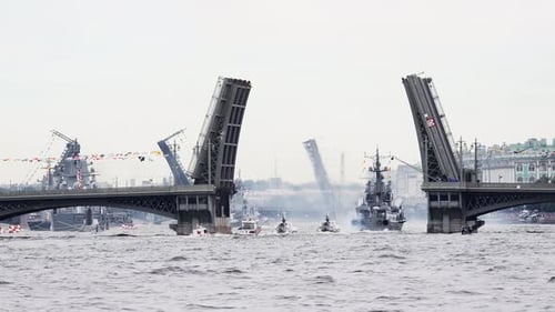 A Lot of Warships Goes Along the Neva River Under Open Bridges at the Time of the Celebration of the