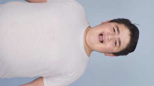 Vertical Video of Boy smiling at camera