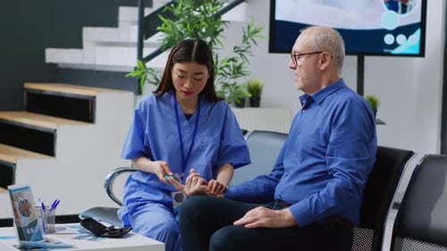 Asian Nurse Measuring Sugar Level