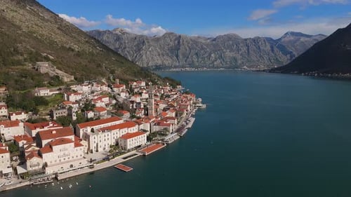 4K drone footage captures Saint Nicholas Church in the charming town of Perast, Montenegro, with a b