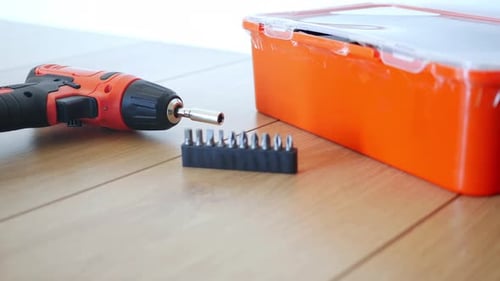 Electric Screwdriver That Includes a Variety of Bits and a Storage Box