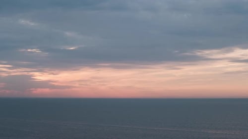 Romantic colorful sunset at the sea. Against the background of the sea, the sun goes down