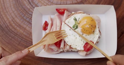 Cutting Egg, Ham, and Tomato Meal