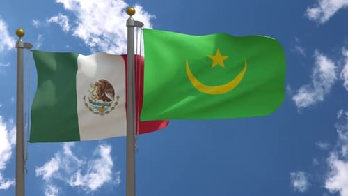 Realistic Flags of Mexico and Mauritania Waving Against Blue Sky