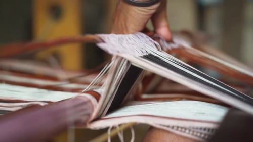 Weaving Colorful Threads on Traditional Hand Loom