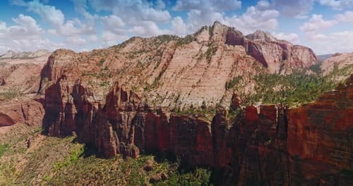 Flying closer to the rugged rock in Zion National Park. Beautiful canyons of America