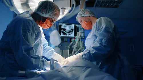 Surgeons Performing Operation in Hospital Operating Room