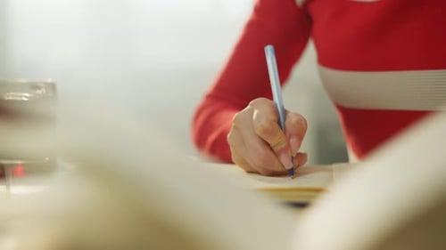 A Woman Works Successfully Online at Home Using a Laptop