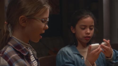Kids Enjoying Playing Domino and Eating Popcorn