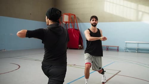 Guys Warm Up By Turning Their Torsos In the Gym
