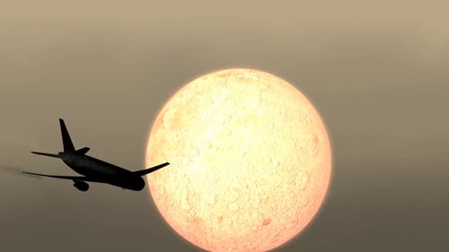 Airplane Silhouette Flies Past Glowing Celestial Body
