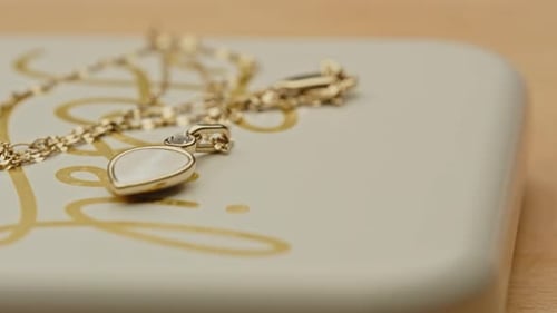 Elegant Gold Necklace with White Teardrop Pendant