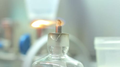 Laboratory candle flame illuminates science research experiment