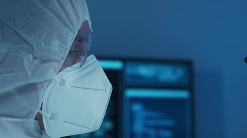 Microelectronics Engineer Works in a Modern Scientific Laboratory on Computing Systems and