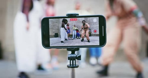 Group of Young Adults Dance While Recording Themselves