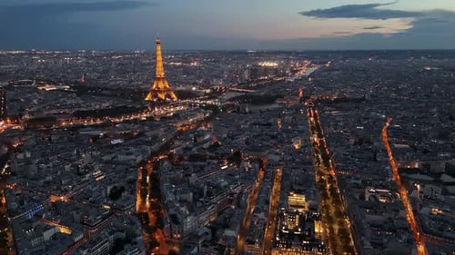 Nighttime aerial view of Paris city center, France