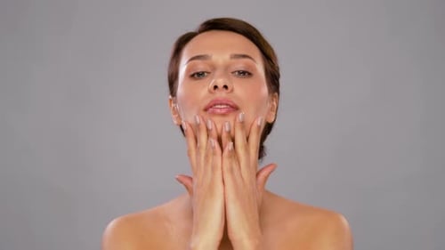 Woman Applying Facial Cream for Skincare Routine