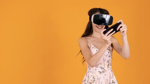 Excited Woman Wearing VR Headset Playing Game