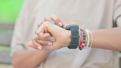 Close up of Woman Using Smart Watch Outdoor
