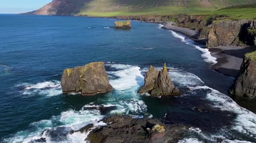 Aerial view of fjord with cliffs and ocean, Iceland.
