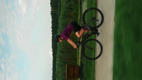 Cyclist riding bicycle at sunset