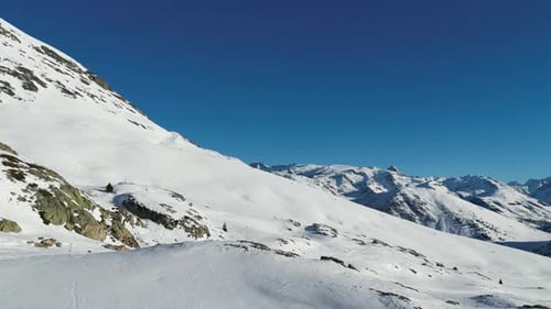 Aerial view of snow-covered mountain, France.