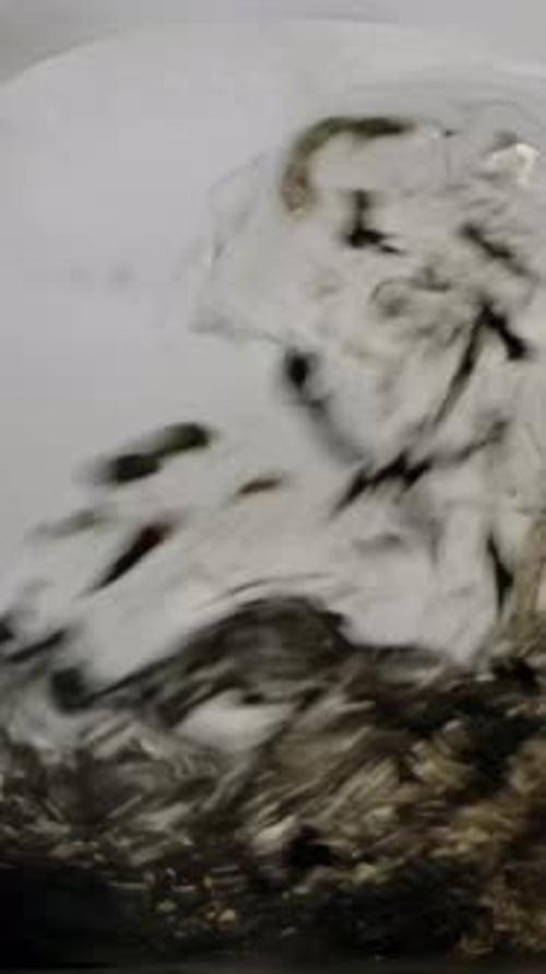 Water Poured Into Loose Leaf Tea Brewing Close Up