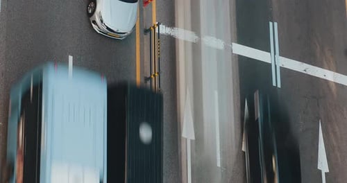 Vehicle Navigating Through Traffic Intersection with Visible Directional Arrows Showcasing Movement