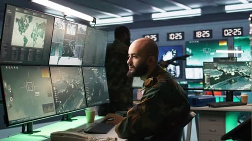 Man Looking at Screens in Military HQ Base Intercepting Ballistic Rockets