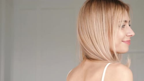 Blonde Woman Smiling and Winking Close Up