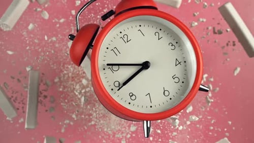 Alarm Clock and School Crayons Fly Up on a Black Background Filmed on a Highspeed Camera at 1000 Fps