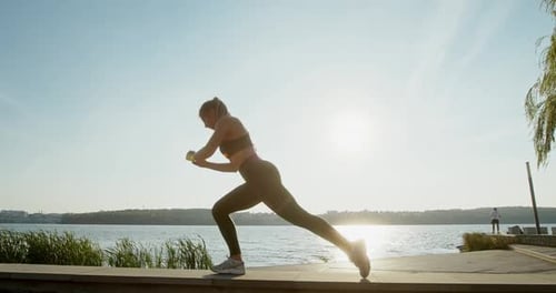 Woman Doing Lunges Outdoors