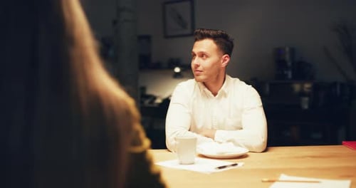 Employees Working Late Into The Night Eat Pizza In Modern Warmly Lit Office In The Evening. Wide ...