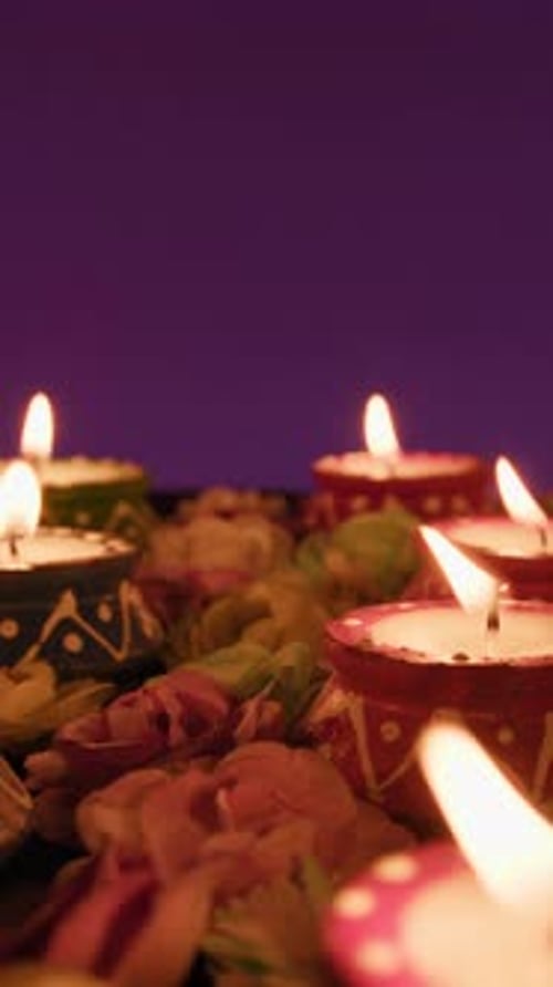Diwali Diyas Candles Flame and Roses Festive Background