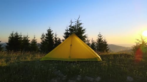 Aerial View of Tourist Camping Tent on Mountain Campsite at Bright Sunny Evening Active Tourism and