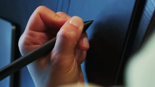 Artist working with graphics digital tablet drawing with stylus. Vertical video
