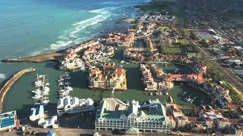 Drone, real estate and a coastal neighborhood by the ocean for luxury apartment