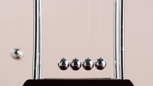 Newton's Cradle Demonstrating Momentum Transfer