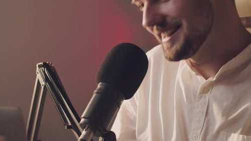 Man Speaking into Microphone for Podcast Recording