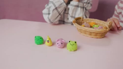 Children Play with Adorable Knitted Toys at Table