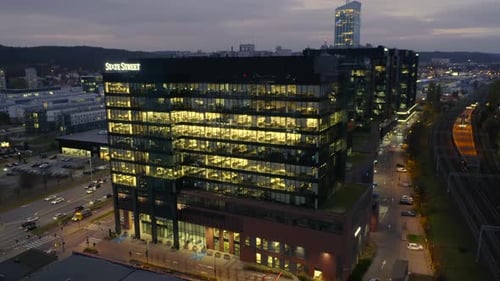 Cinematic Drone View of LateNight Office Life in a Glass Skyscraper