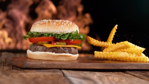 Delicious Burger and Fries on Wooden Cutting Board