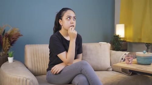 The young woman swaying nervously in her seat.