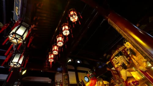 Lanterns illuminating emperor figures